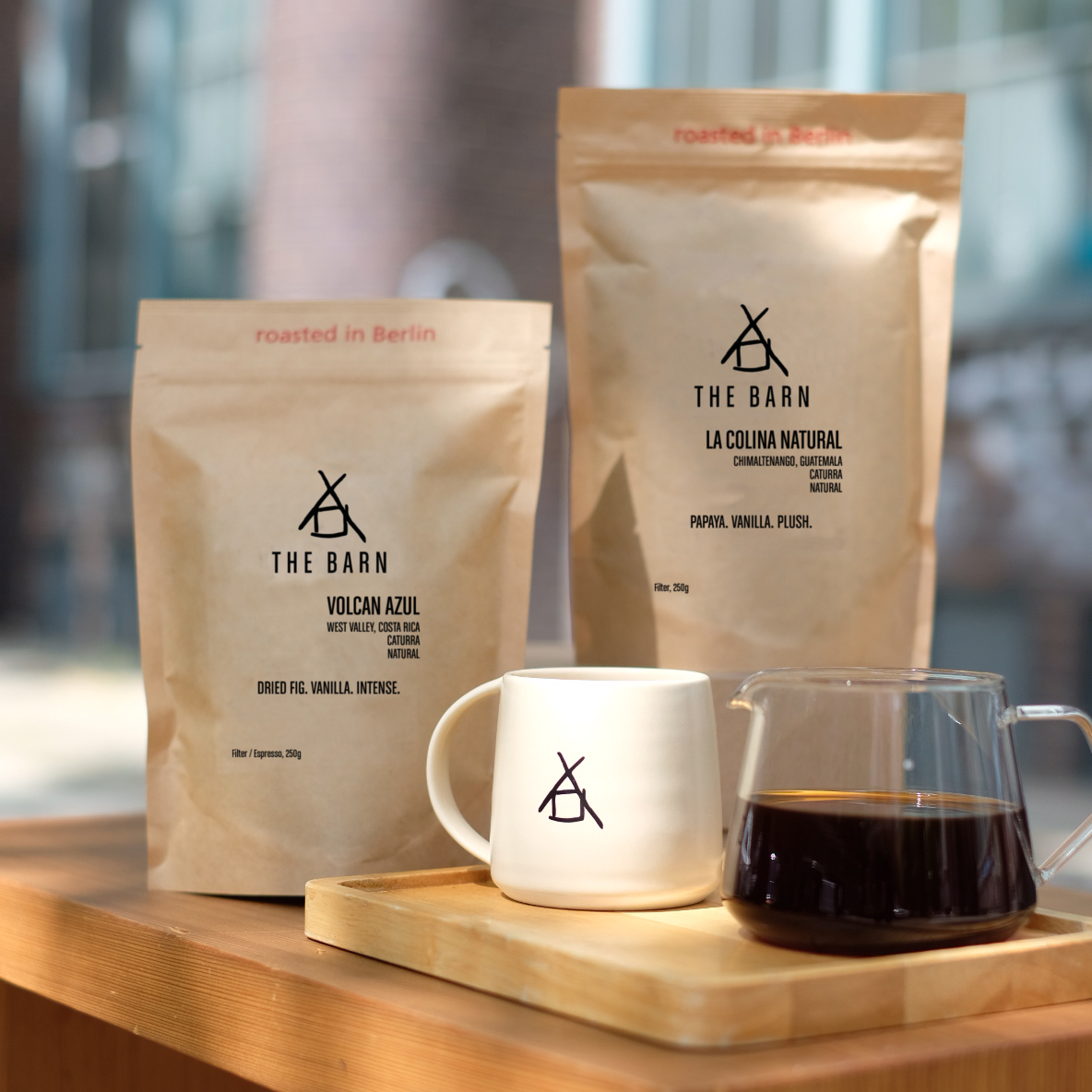 Two bags of coffee with THE BARN sandstone mug.